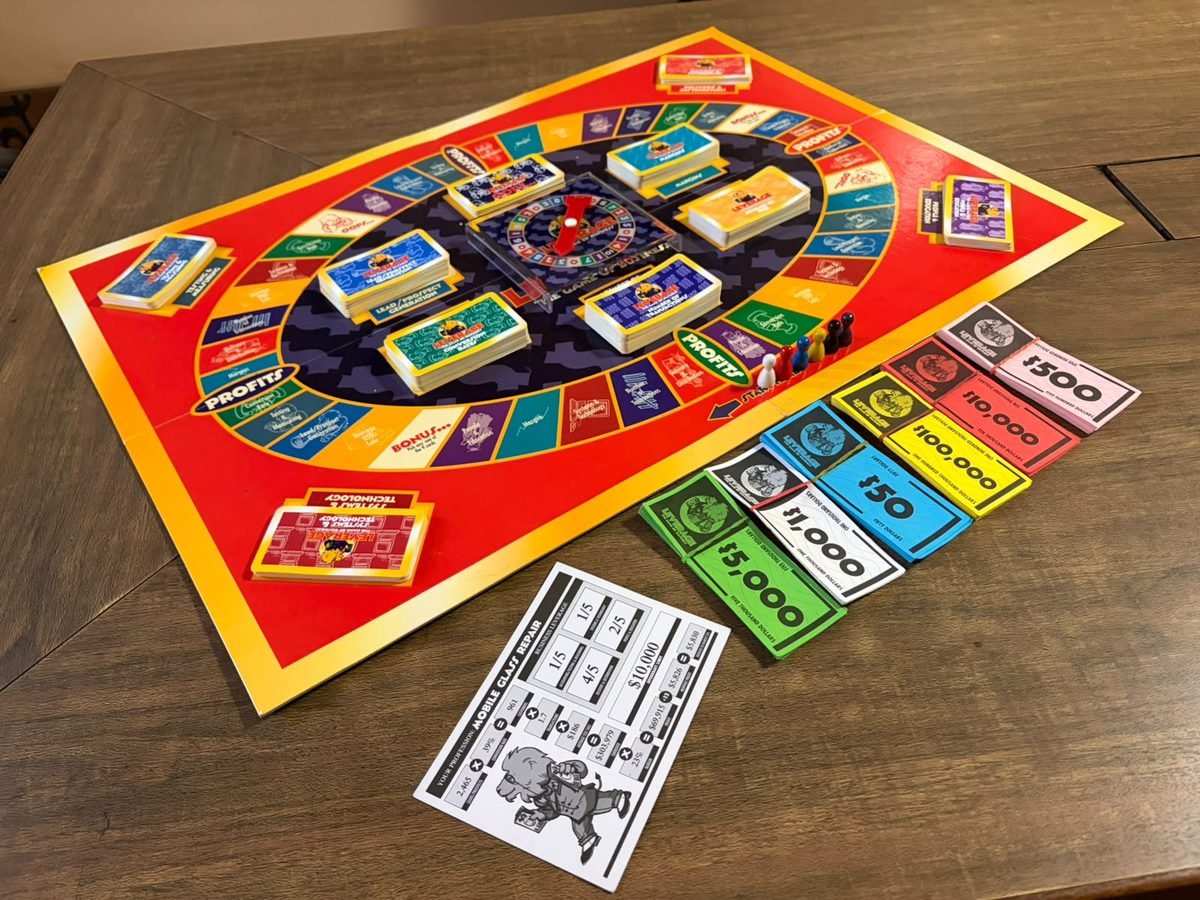 The LEVERAGE board laid out with cards and money